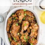 Finished wings in a white serving dish.