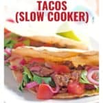Close-up of shredded beef tacos with tomatoes and onions; text reads Shredded Beef Tacos (Slow Cooker).