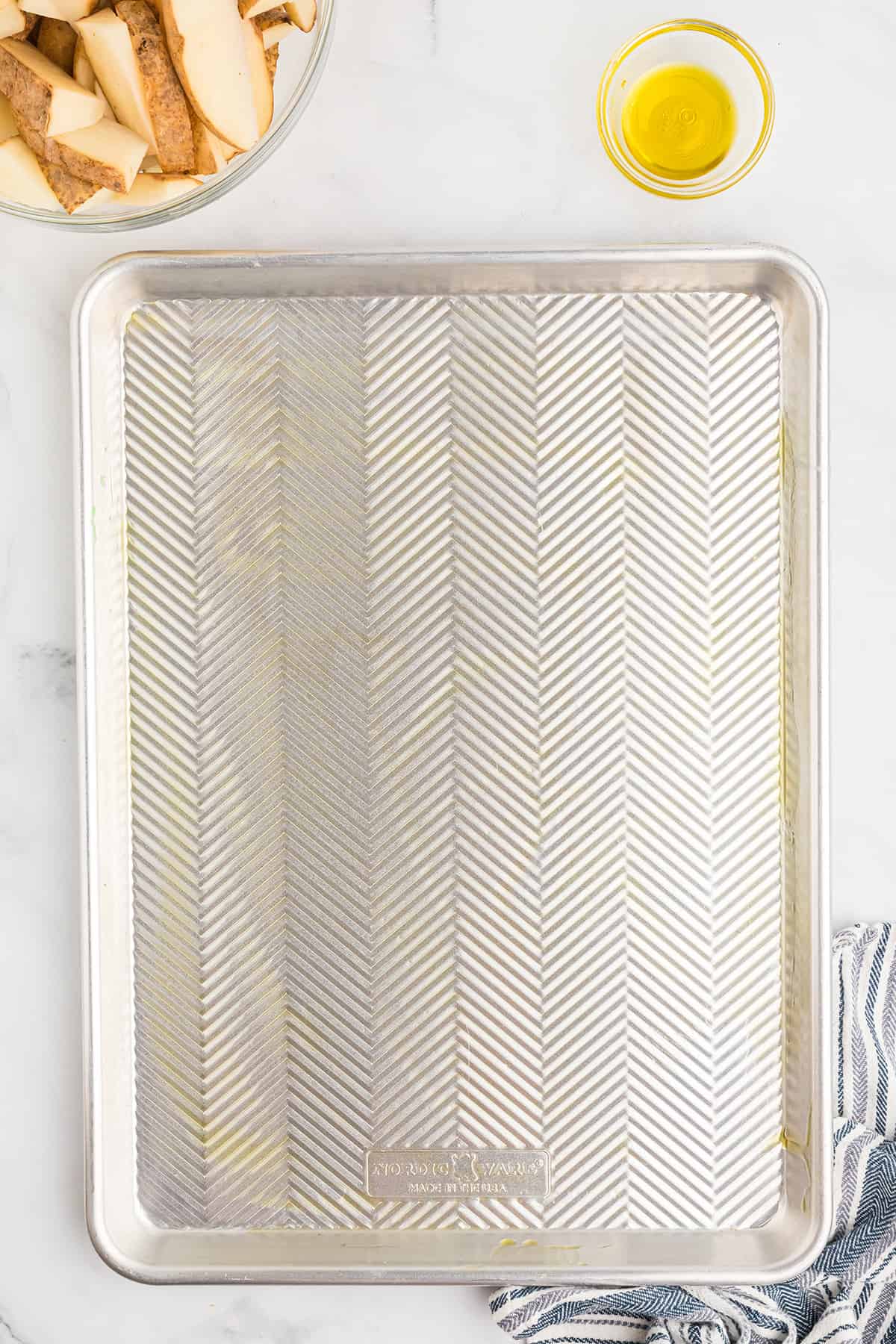 A baking sheet lightly coated with olive oil.