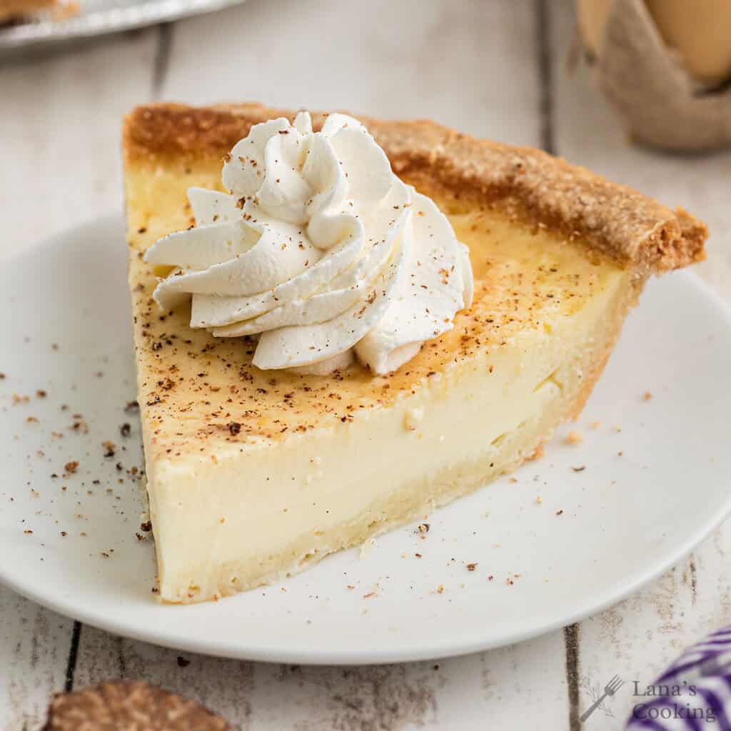 Finished egg custard pie with whipped cream.