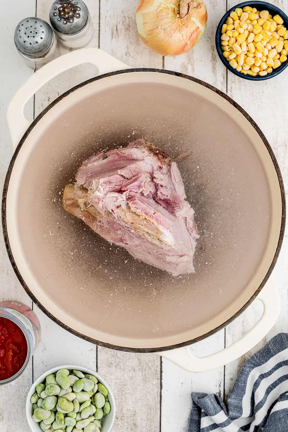 Ham bone and water in a large pot.