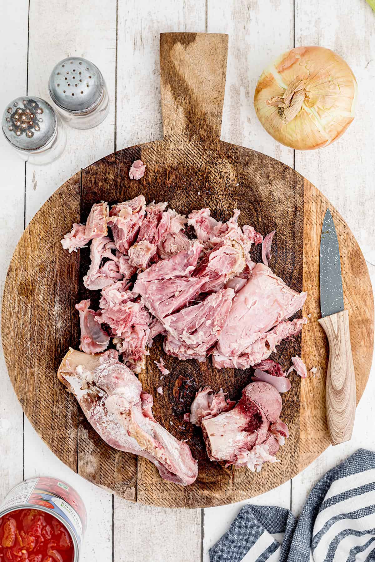 Ham removed from the bone and diced on a board.