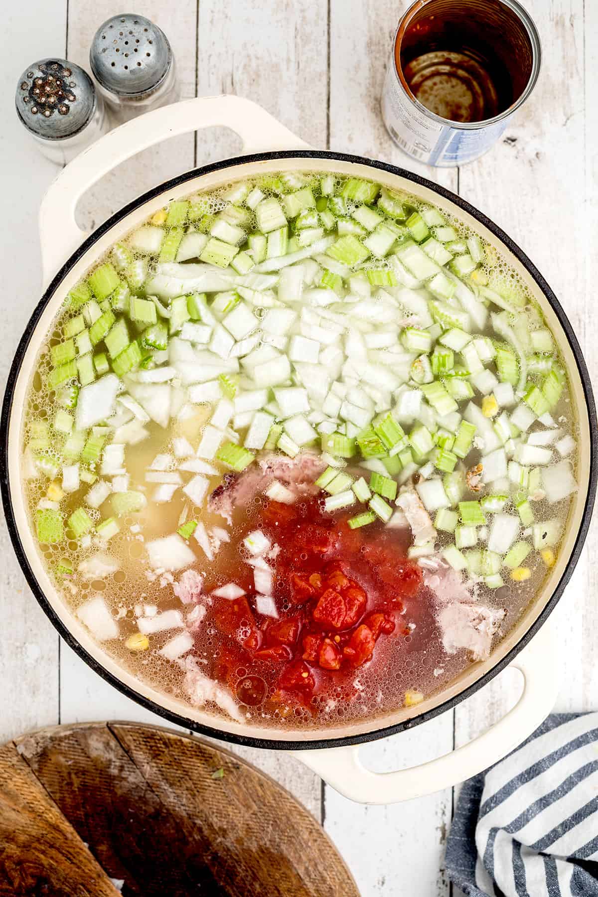 Onion, celery, and tomatoes added to the ham broth.