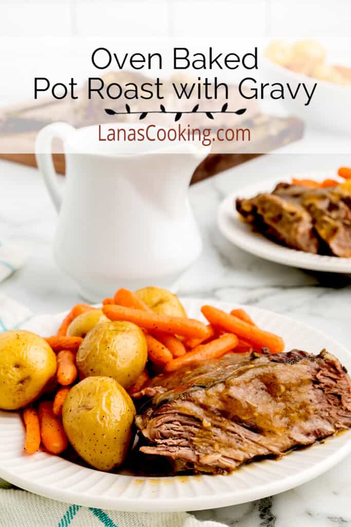 A serving of pot roast with potatoes and carrots on a white plate.