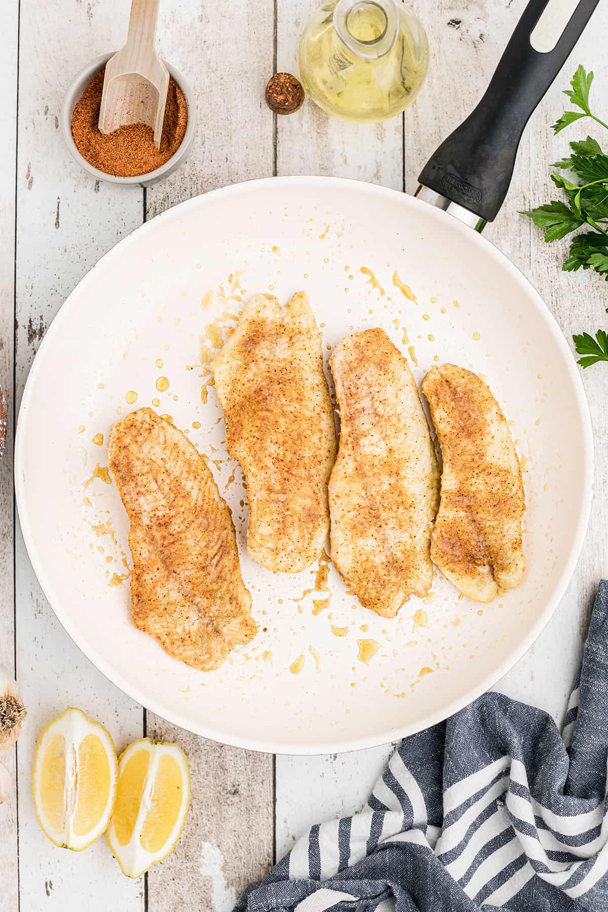 Cooked fish fillets on a plate.