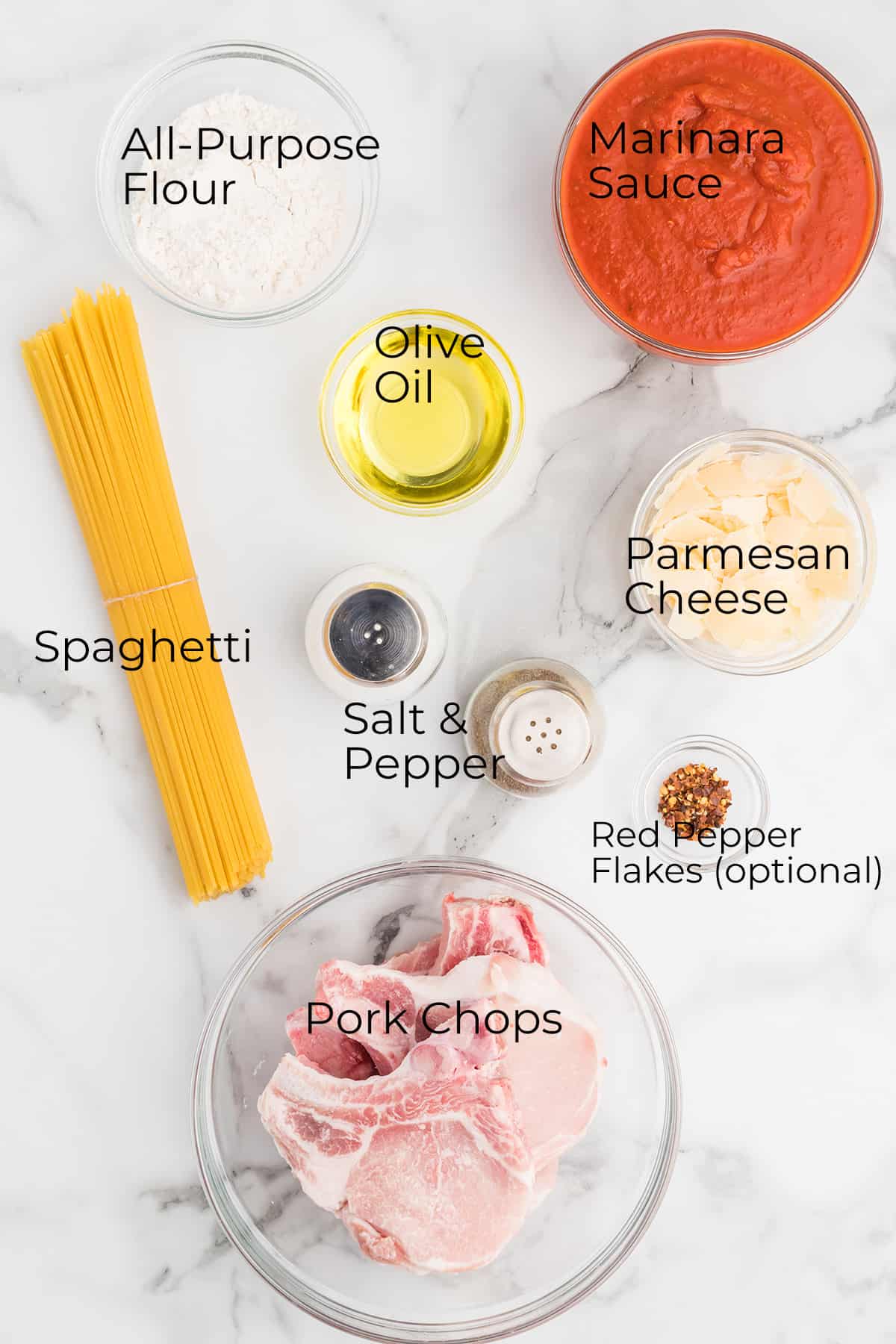 All ingredients needed to make pork chops with pasta.