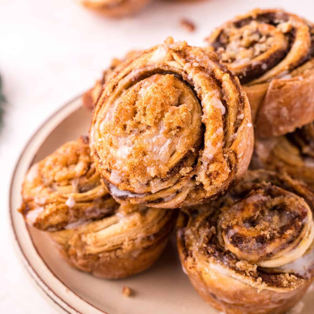 Finished cruffins stacked on a serving plate.