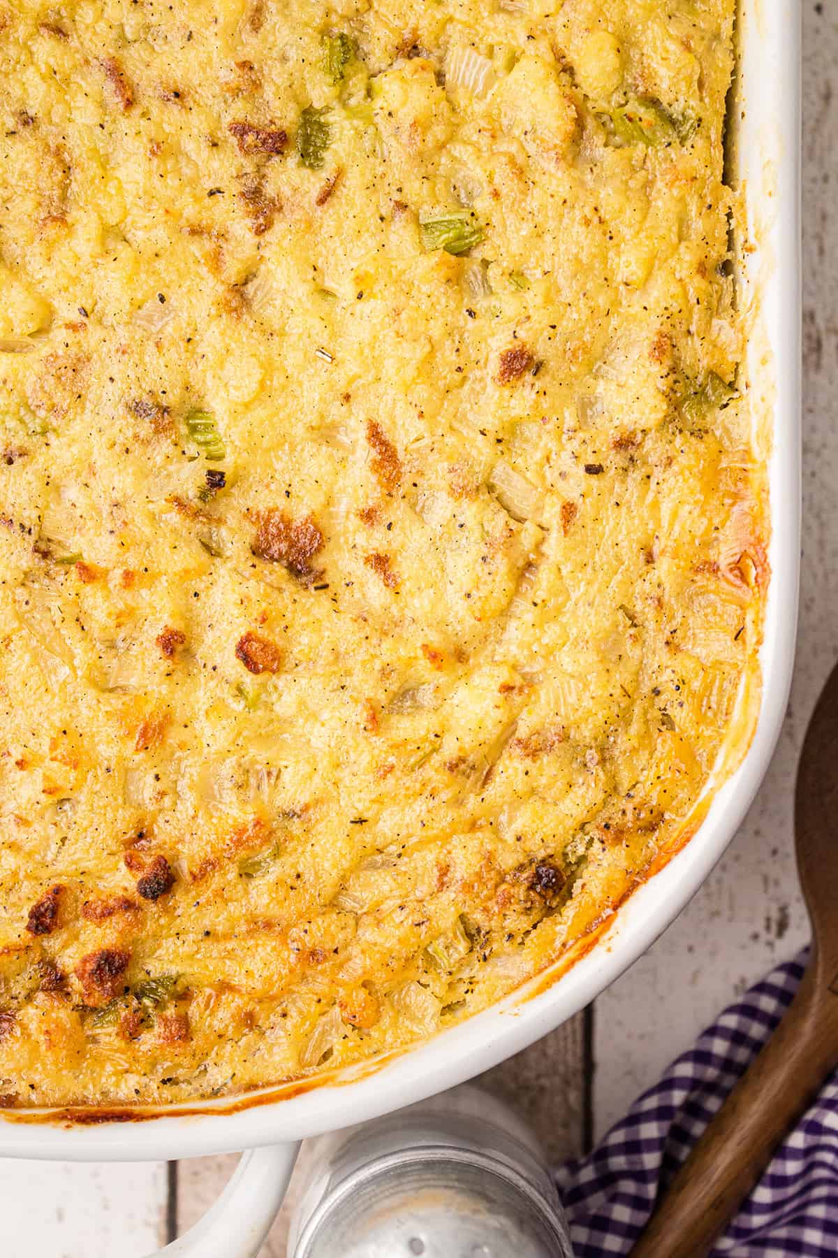 Cornbread dressing in a white baking dish.