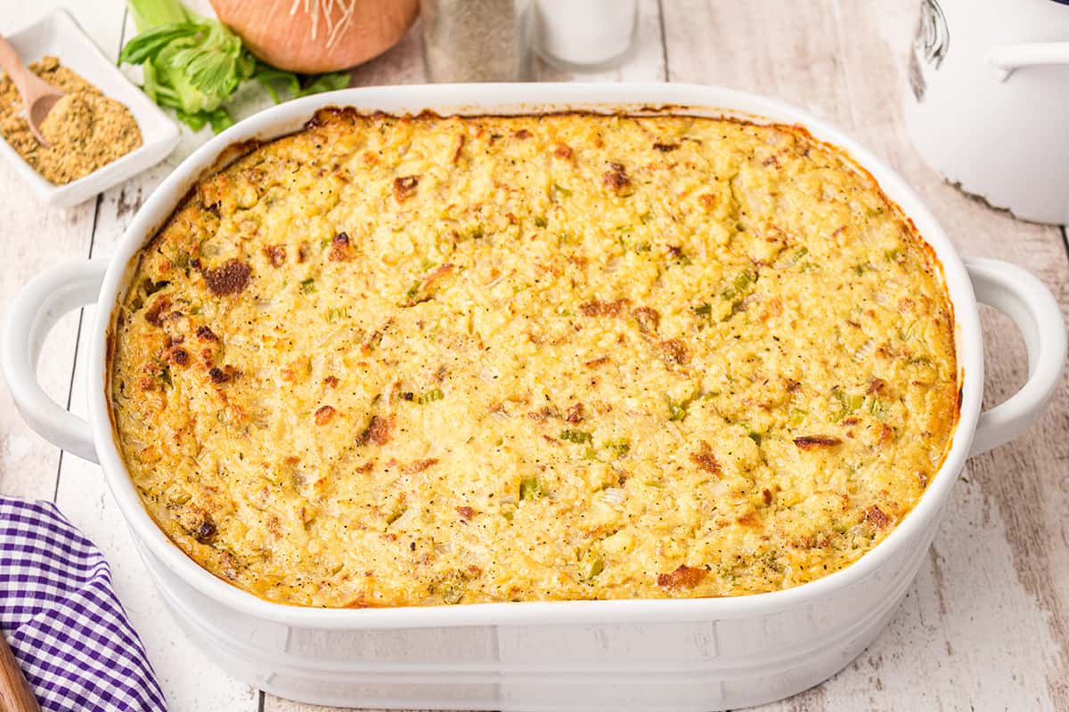 Cornbread dressing in a white baking dish.