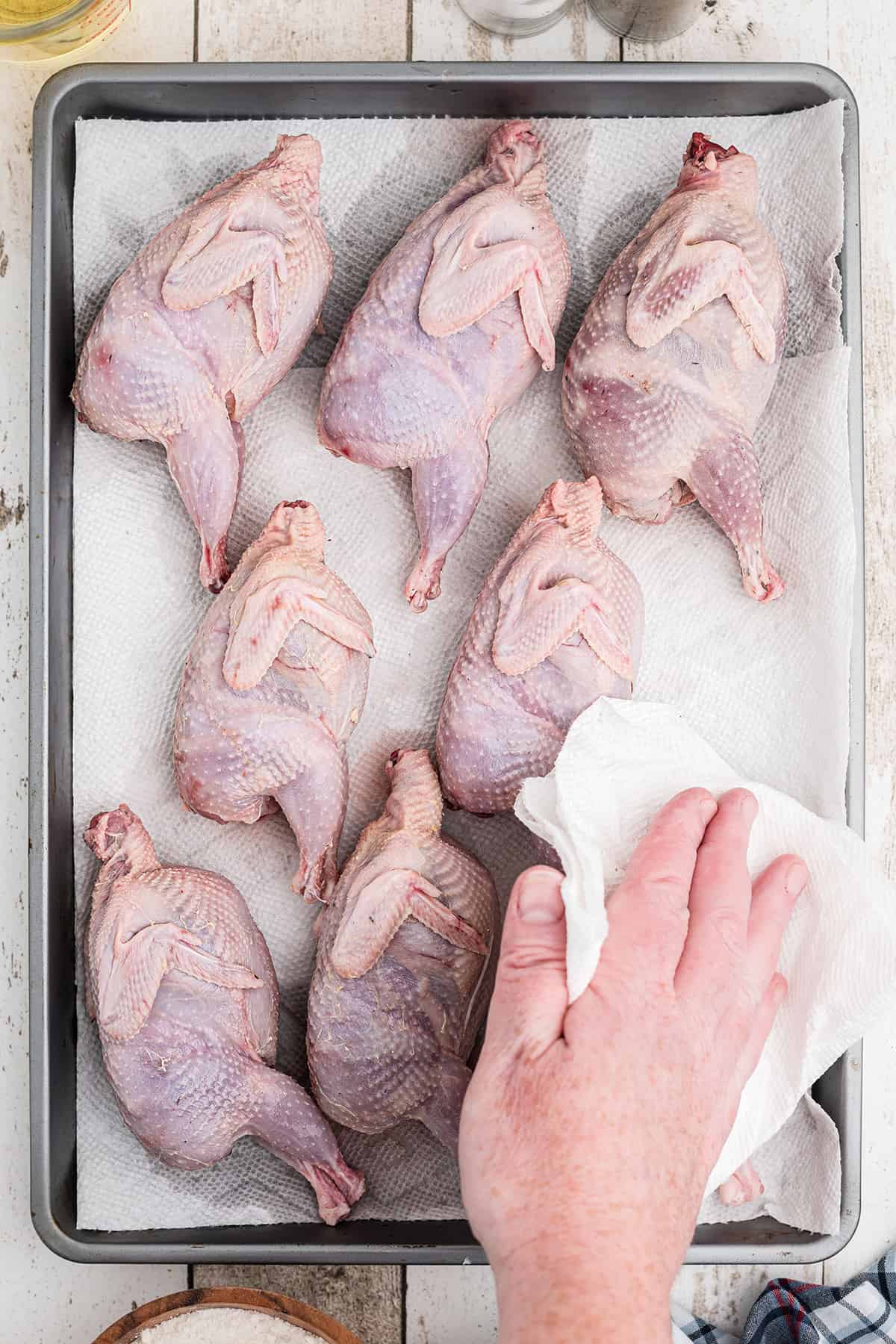 Drying whole prepared quail.