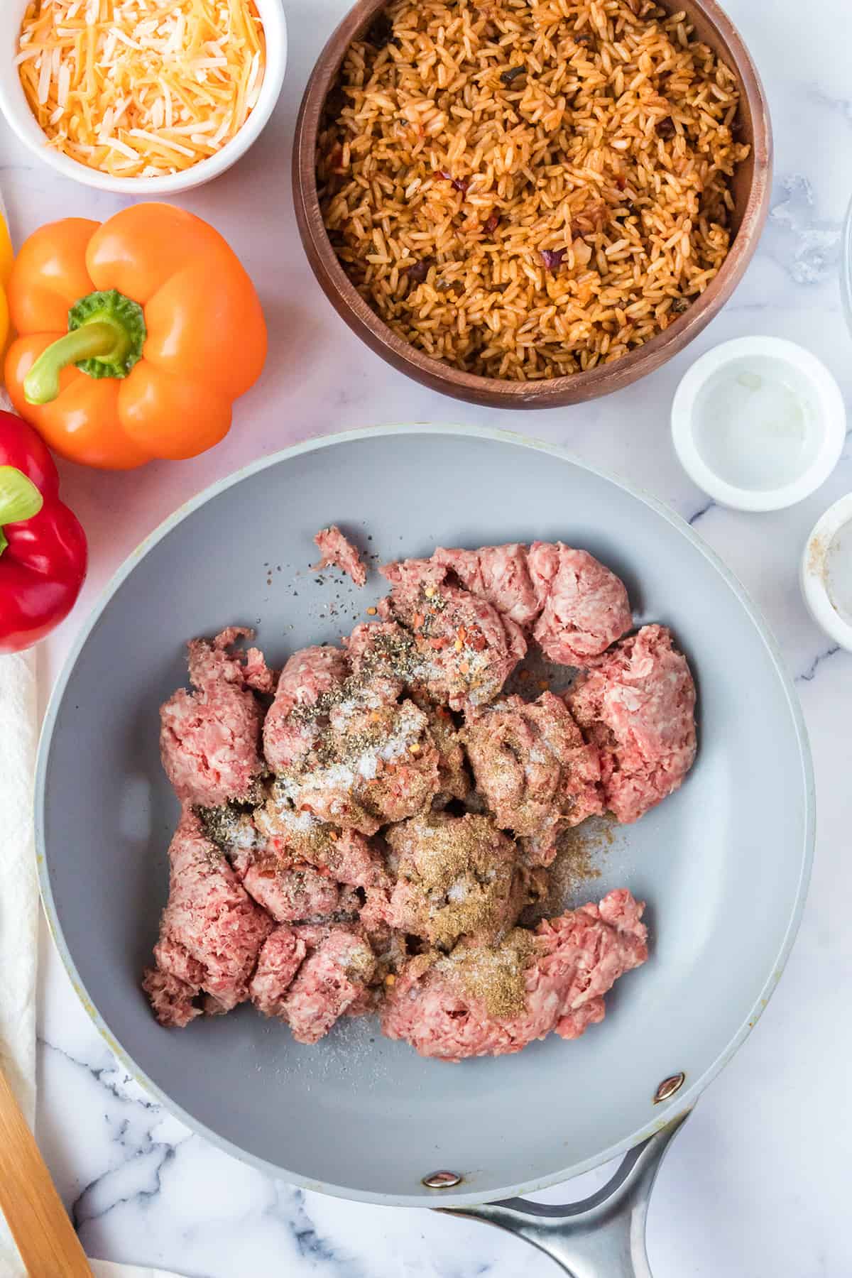 Ground beef added to a skillet.