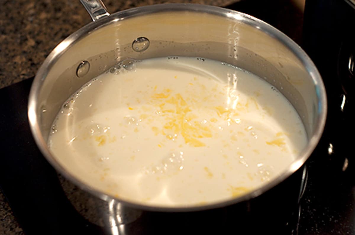 All ingredients for tapioca pudding in a saucepan.