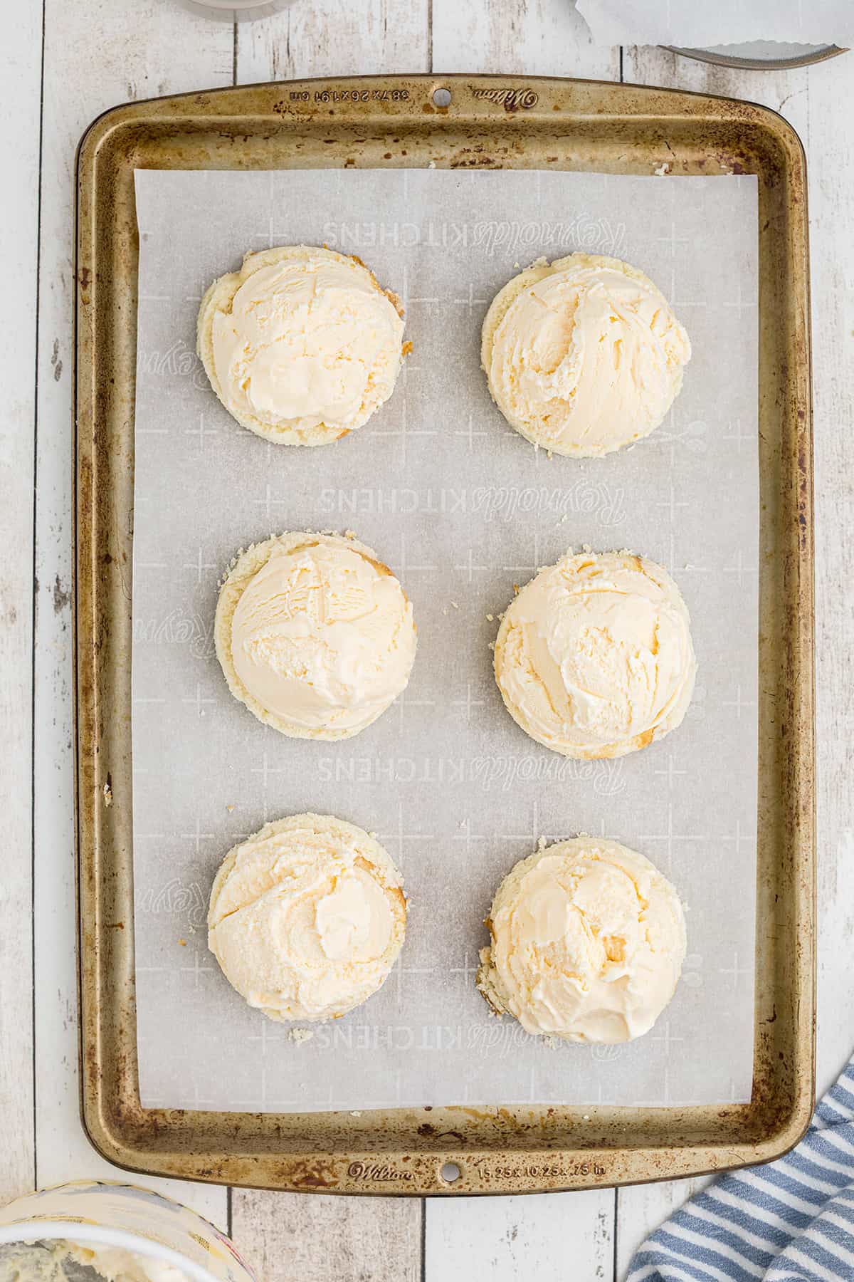 Cake rounds topped with vanilla ice cream.