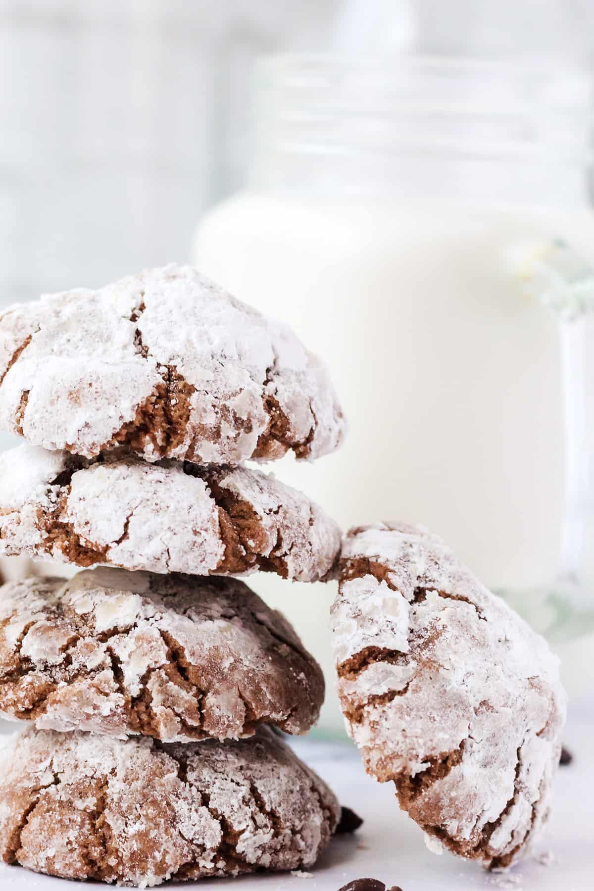 Crinkle cookies stacked on a marble backdrop..