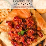 Finished baked brie on a serving board.