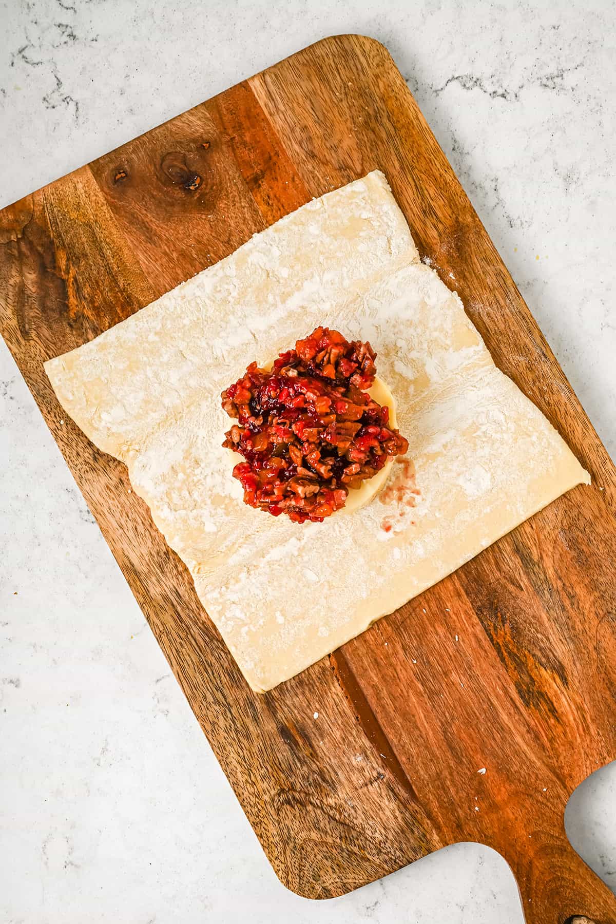 Brie topped with cranberry mixture.
