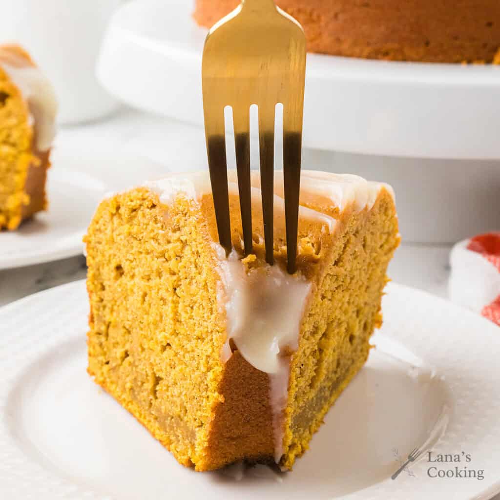 A slice of cake with a fork inserted in the top.