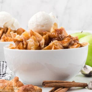 A serving of cobbler with a scoop of ice cream.