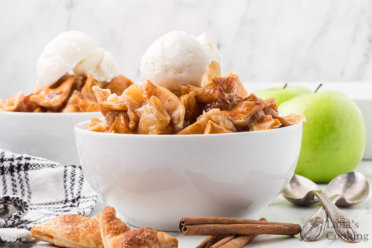 A serving of cobbler with a scoop of ice cream.