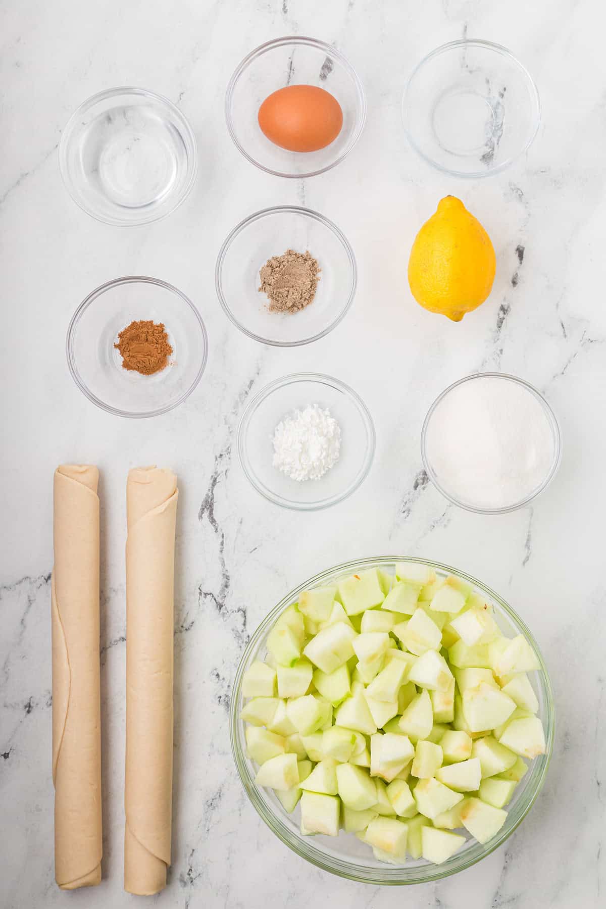 All ingredients you'll need to make a patchwork apple cobbler.