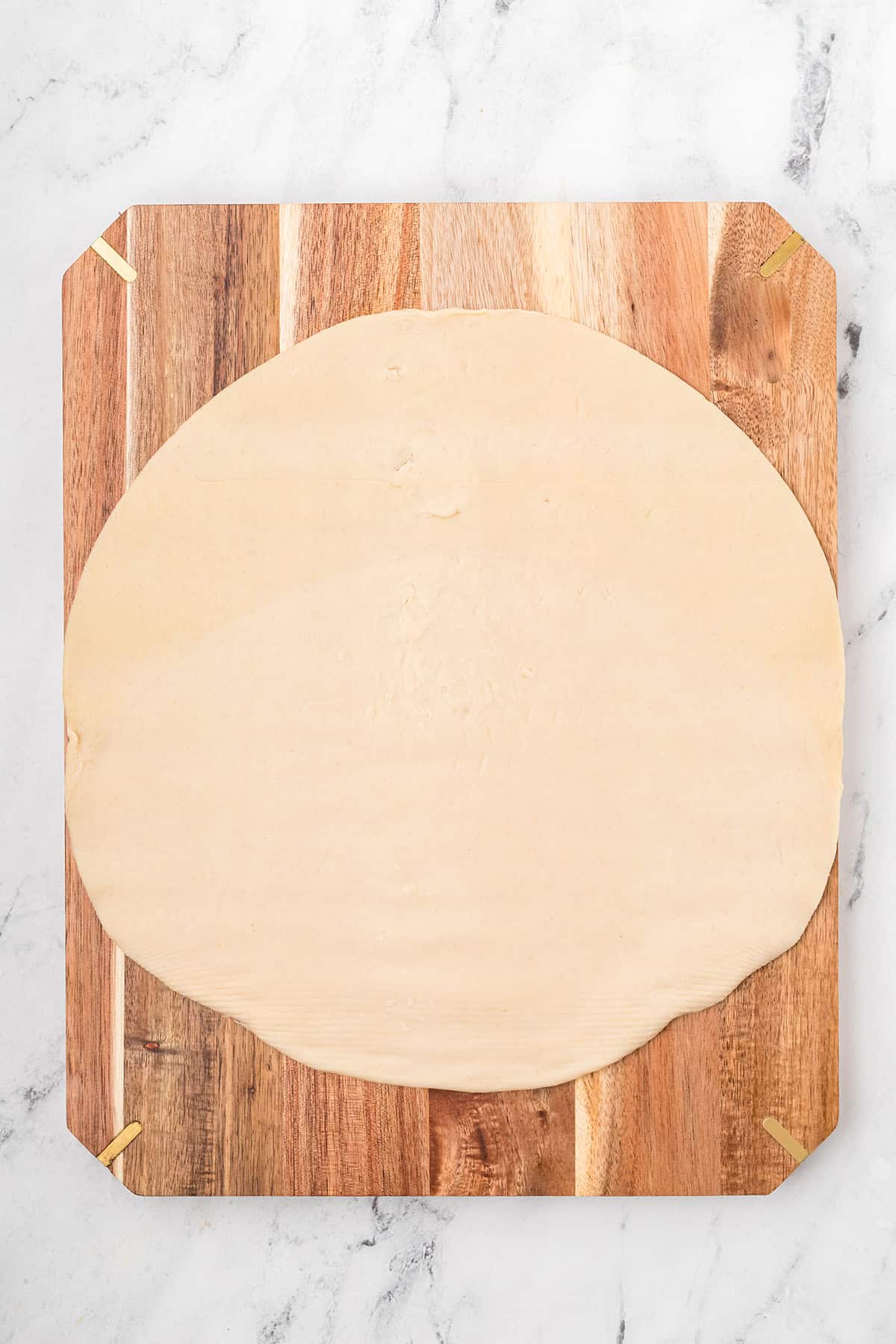 Rolled out pie crust ready to cut into patchwork pieces.