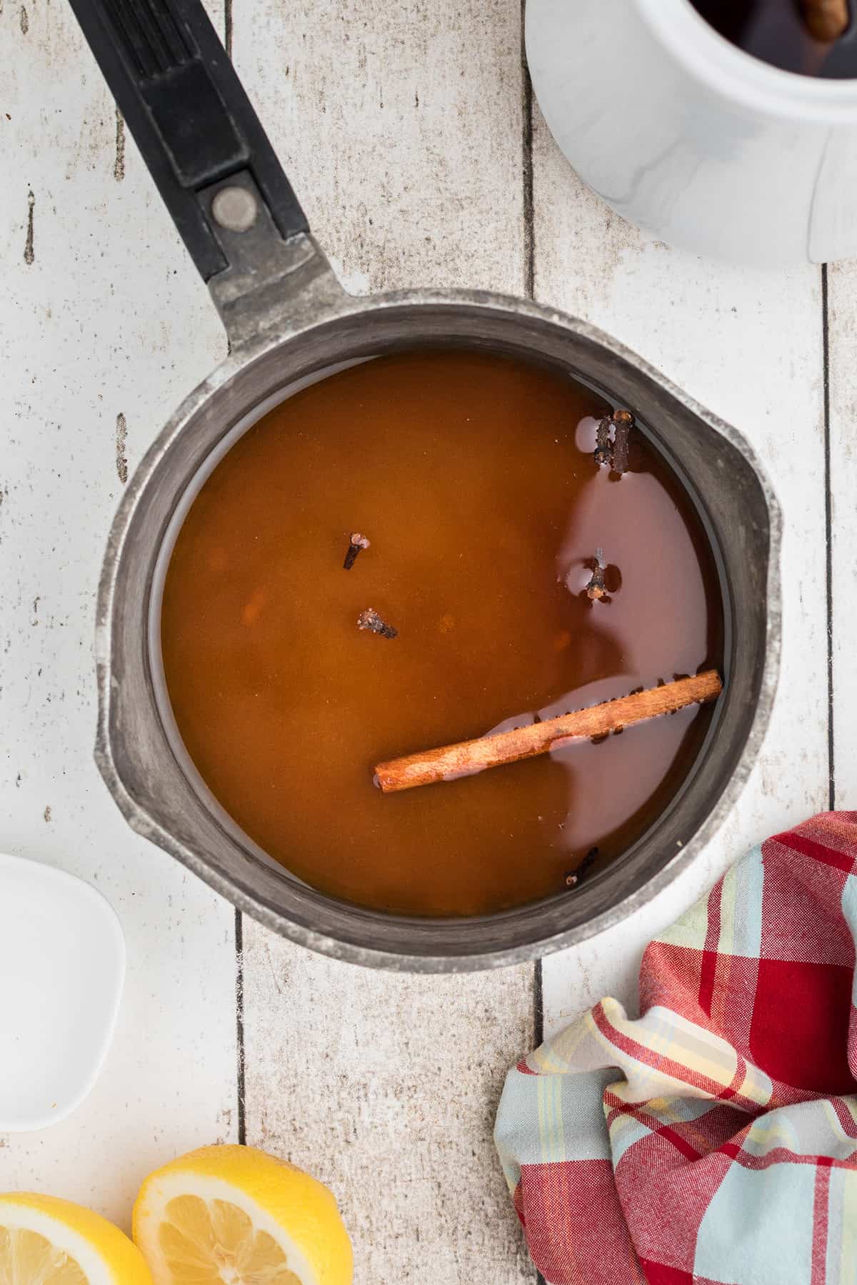 Water and spices in a saucepan.