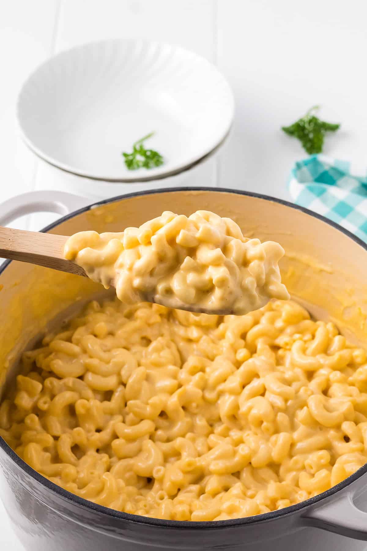 A Dutch oven filled with macaroni and cheese.