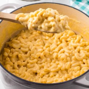 A Dutch oven filled with macaroni and cheese.