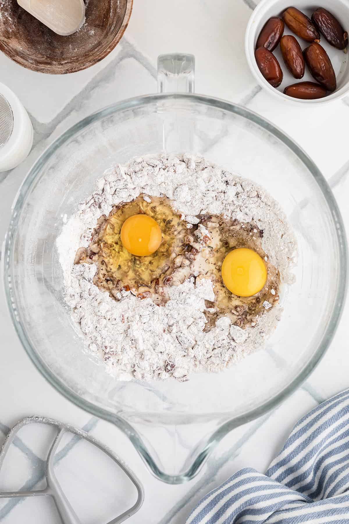 Eggs added to the mixing bowl.