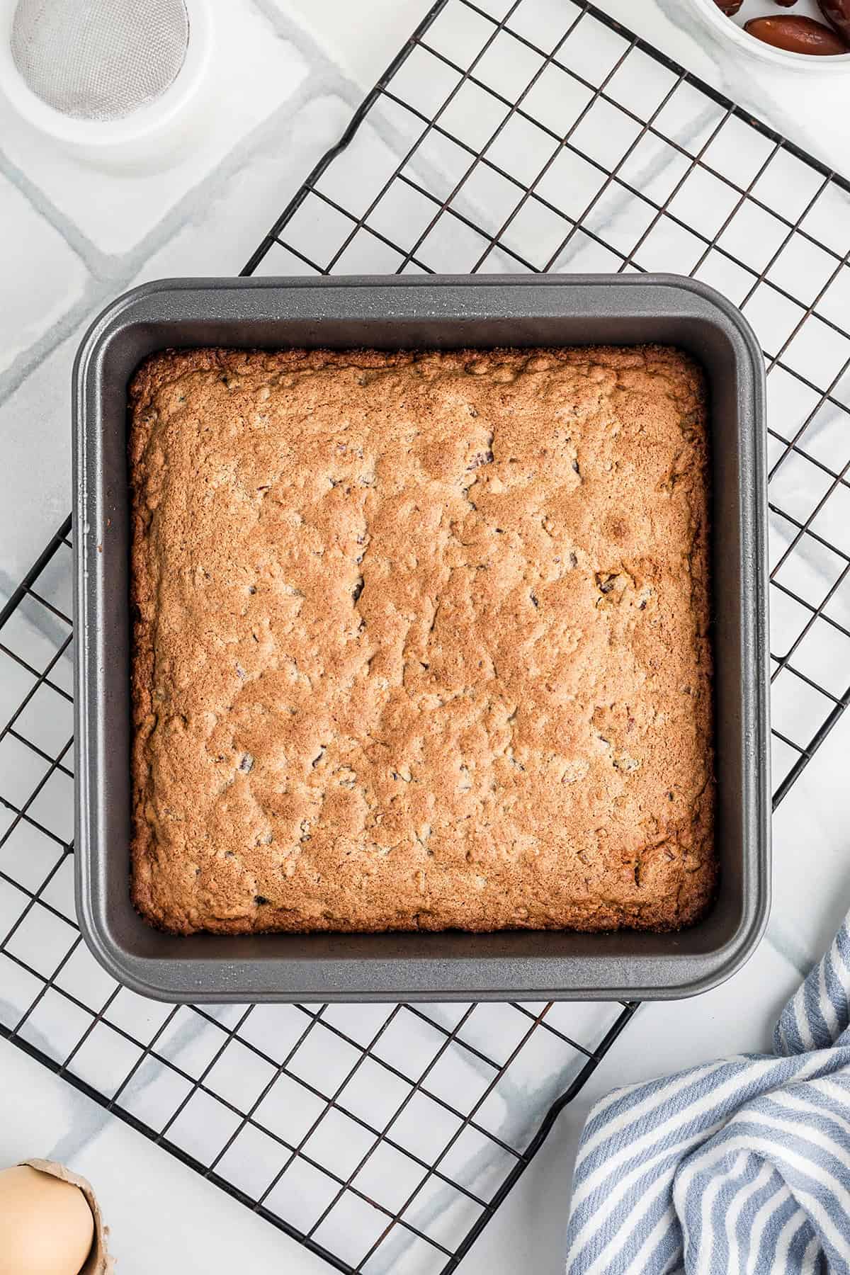 Baked chews cooling in the pan on a wire rack.