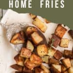 Finished home fries in a skillet.