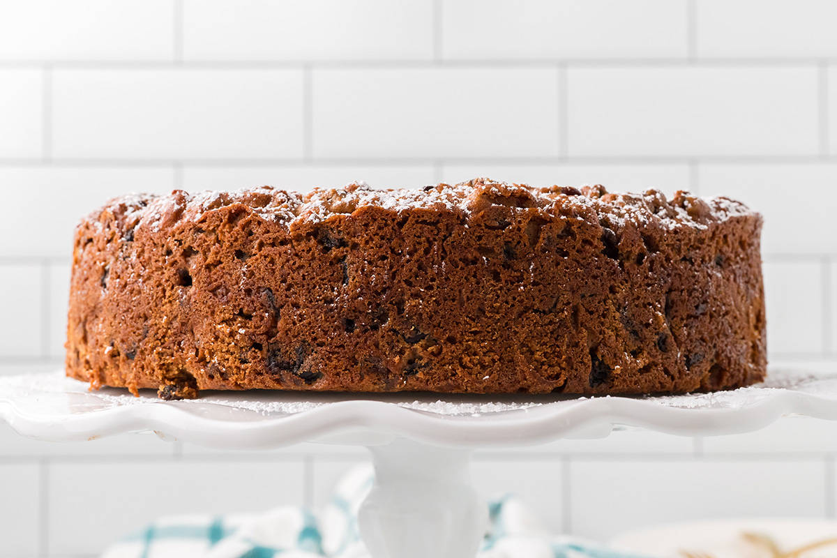 A cake on a white pedestal.