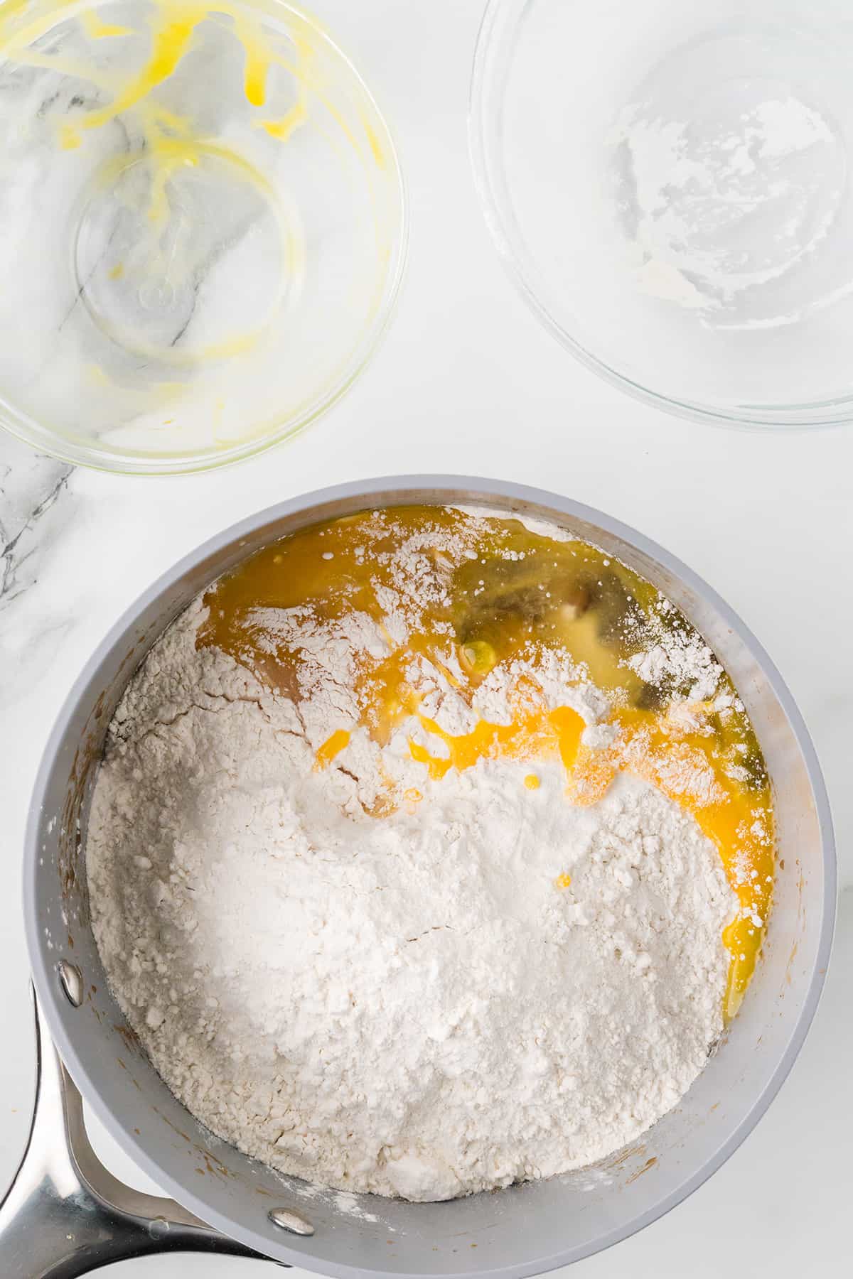 Flour and eggs added to boiled ingredients.
