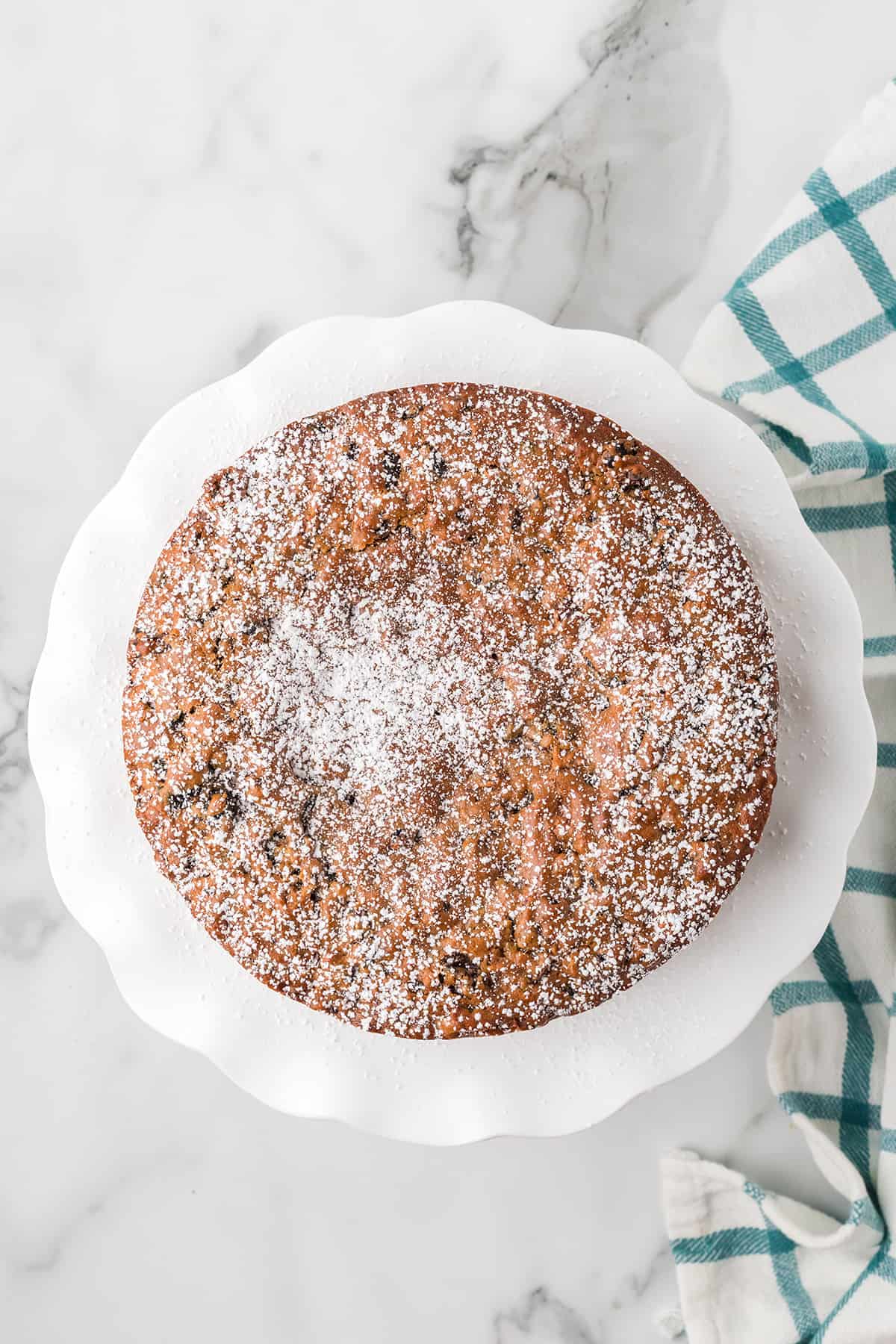 Finished fruitcake with a dusting of powdered sugar.