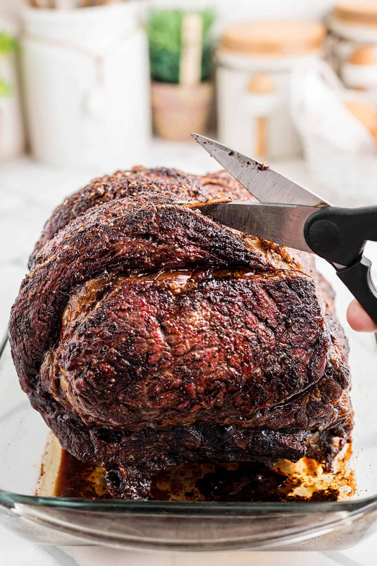 Removing the string ties from the finished roast.