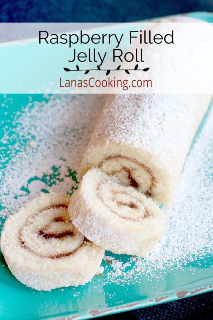Finished raspberry jelly roll dusted with powdered sugar.