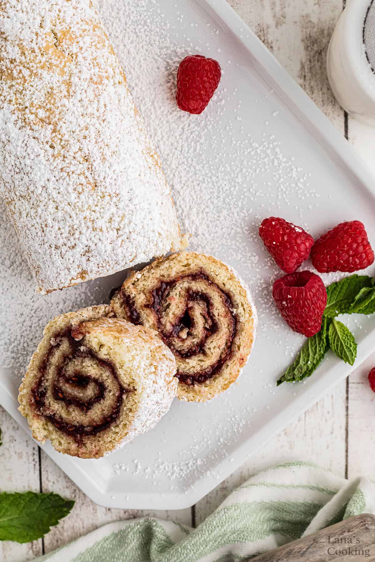 Slices of jelly roll cake on a white plate.