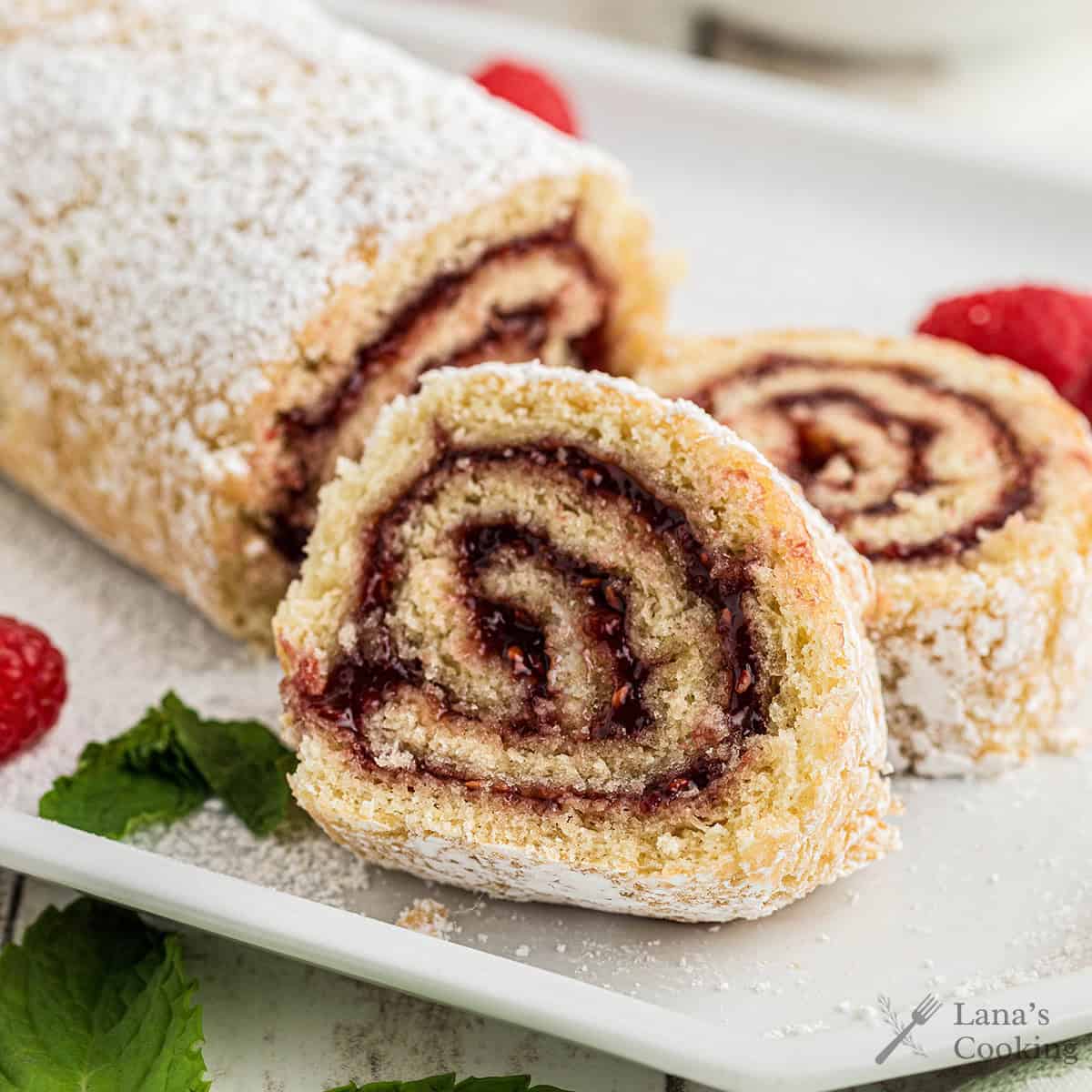 Slices of jelly roll cake on a white plate.