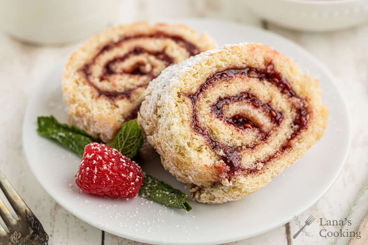 Slices of jelly roll cake on a white plate.