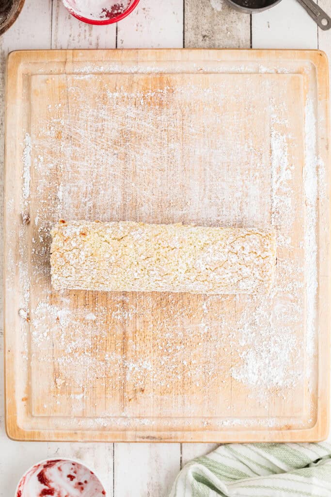 Rolled cake on a wooden board.