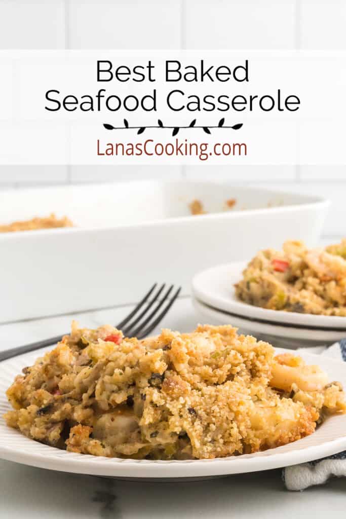 A serving of seafood casserole on a white plate with a fork on the side.