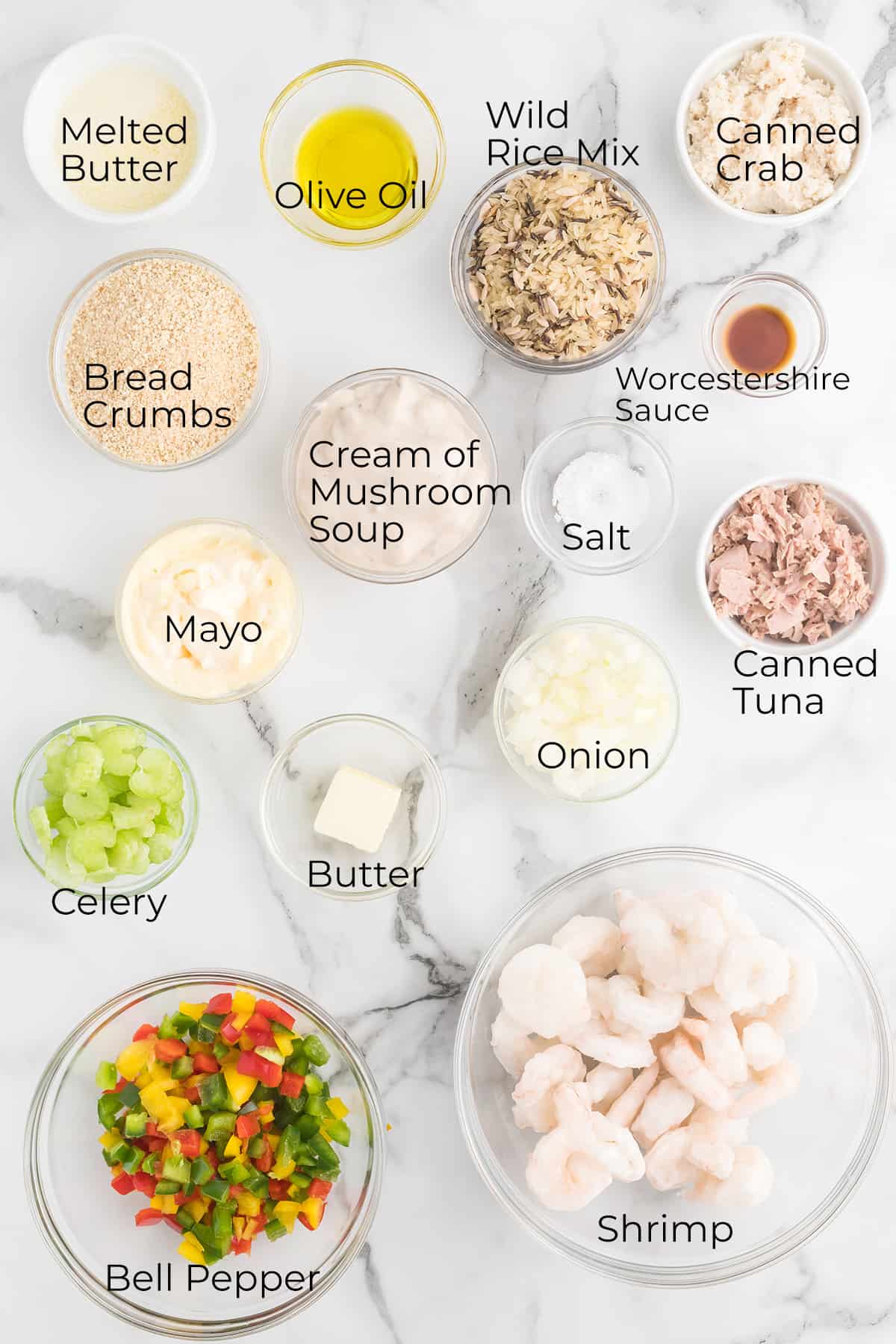 All ingredients needed to make baked seafood casserole.