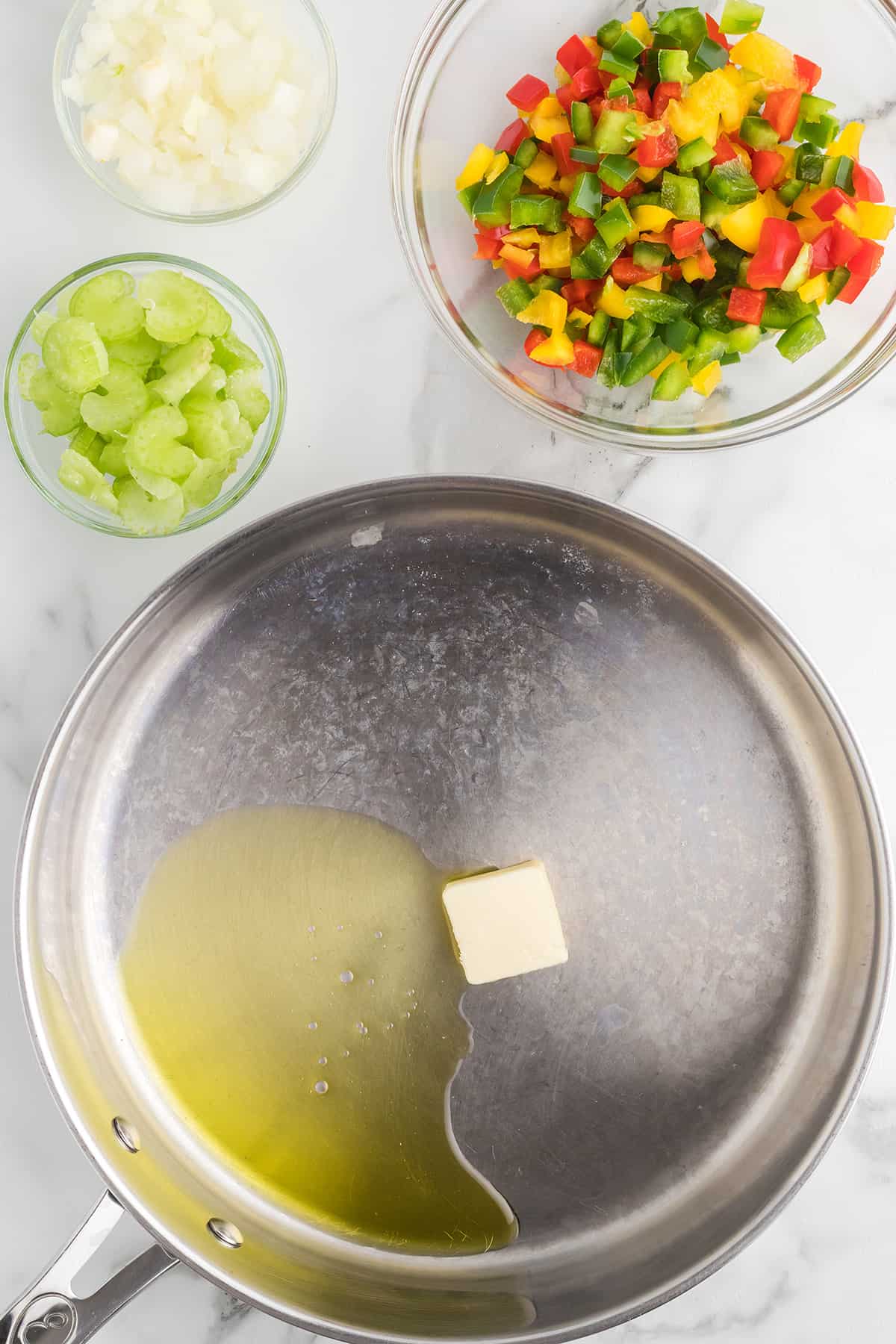 Oil and butter melting in a skillet.