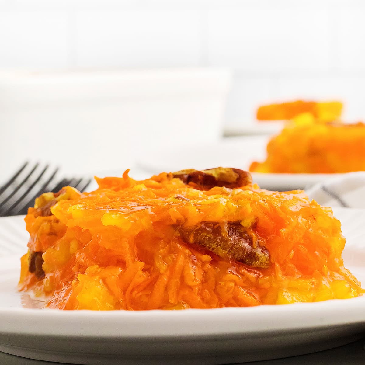 A serving of sunshine salad on a white plate.