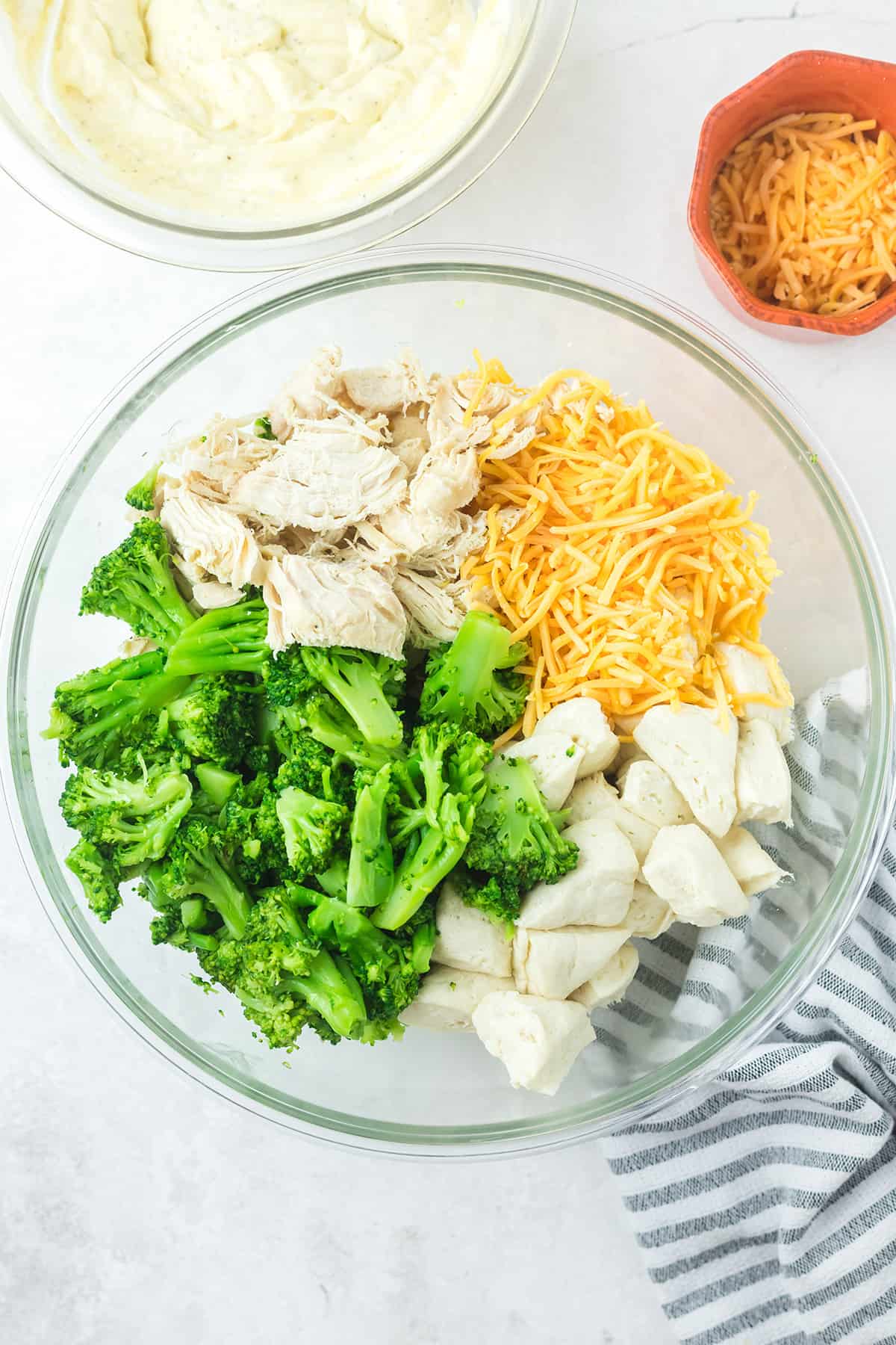 Chicken, broccoli, and cheese in a large bowl.