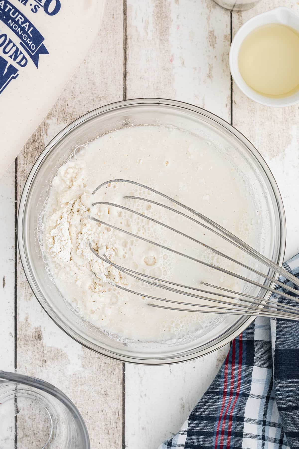 Stirring ingredients with a wire whisk.