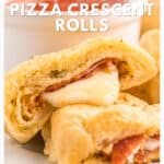 Close-up of pepperoni pizza crescent rolls with melted cheese and a side of dipping sauce.