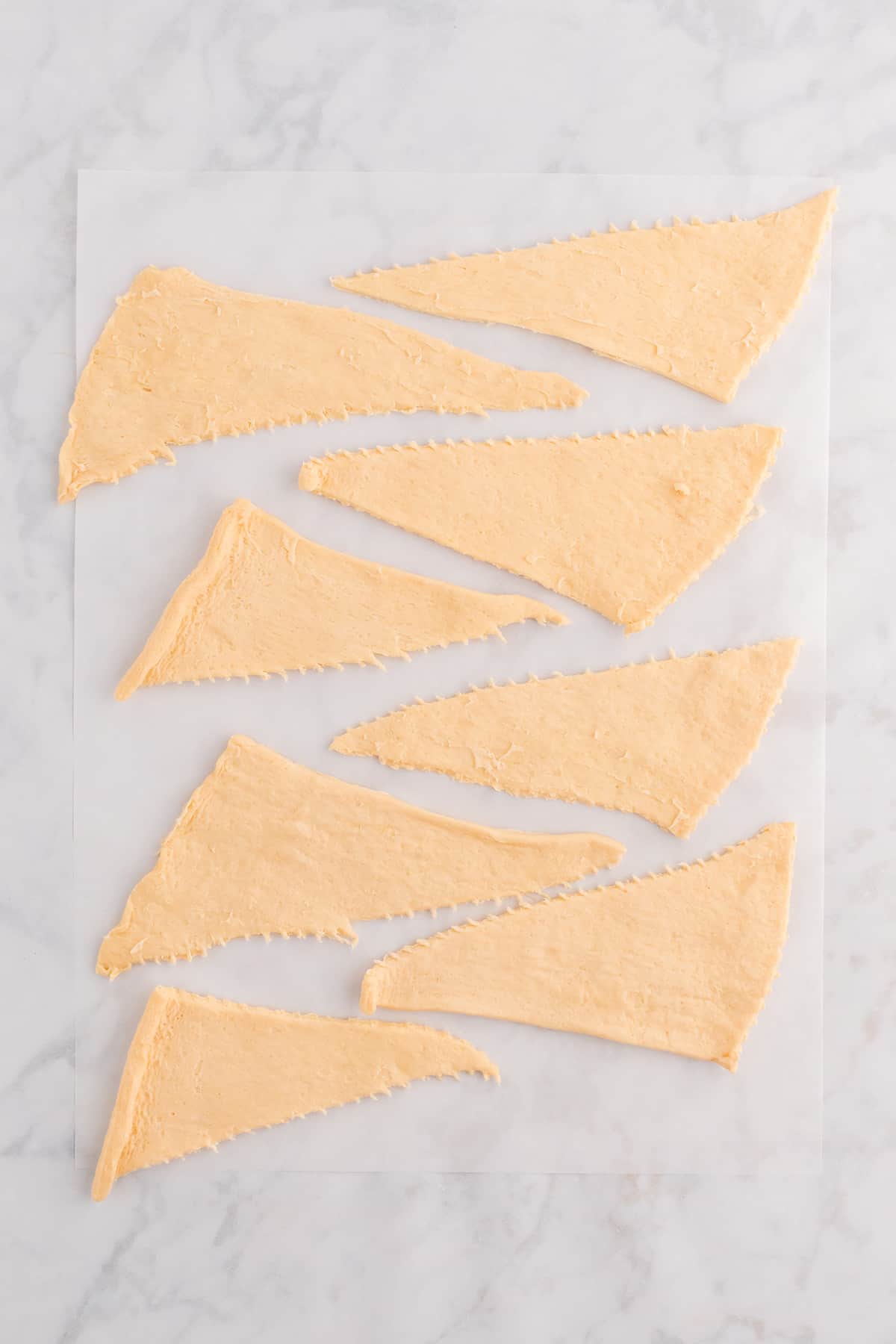Crescent dough separated into triangles.