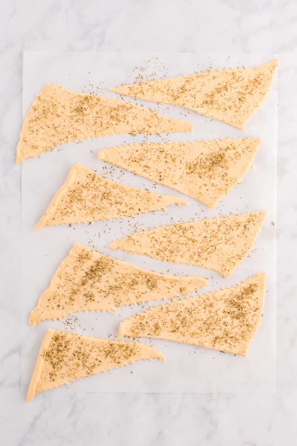 Dough sprinkled with seasonings.