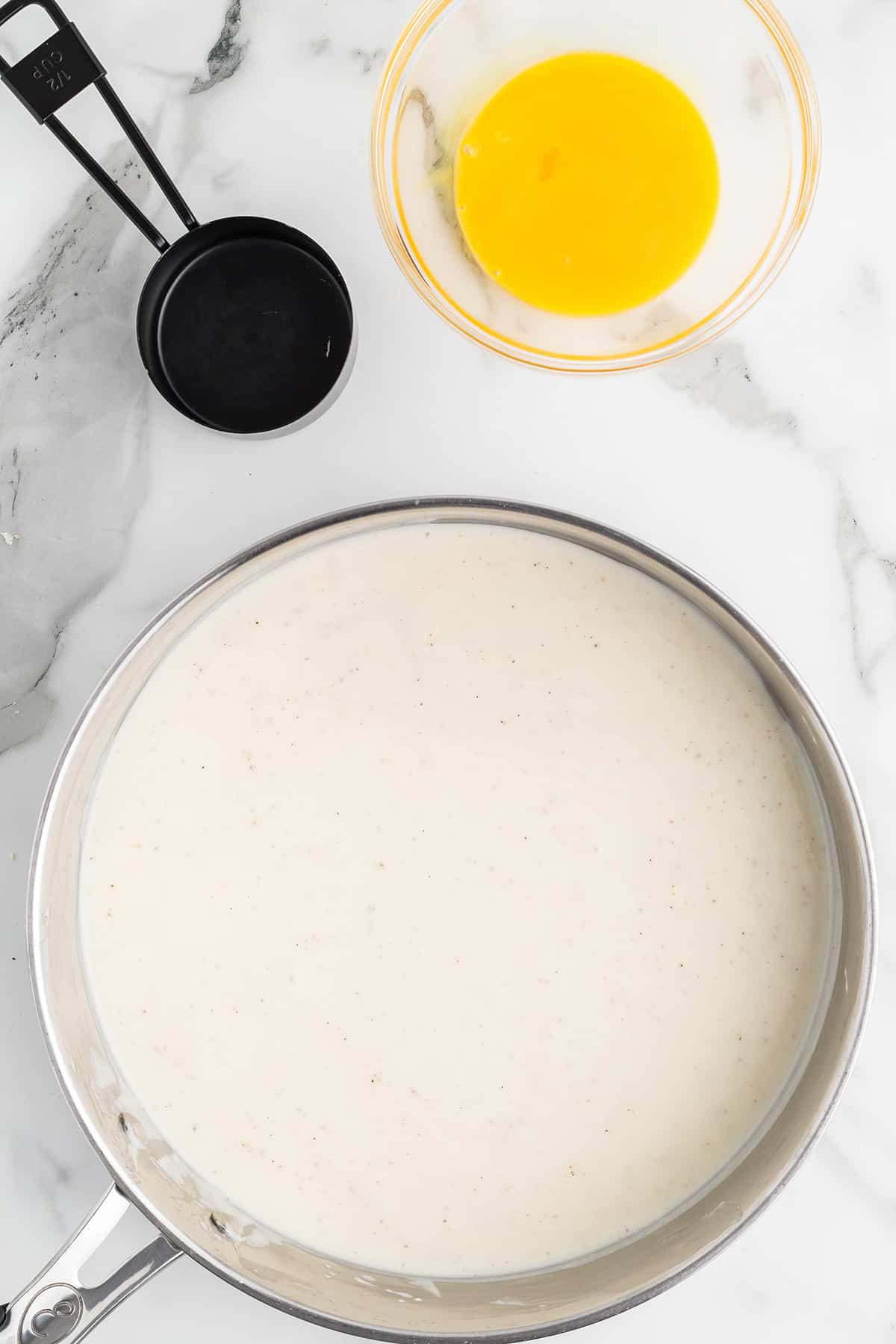 Broth and flour mixture cooking in the skillet.